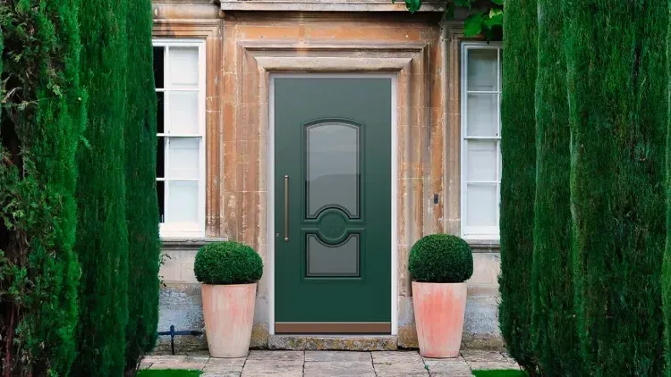 Green front door with classic design