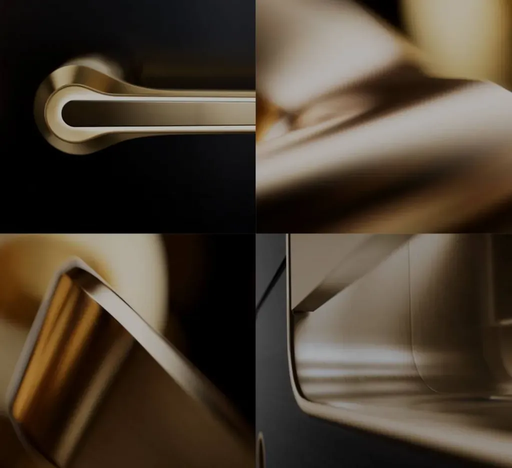 Zlati ročaj za vrata z gladko površino in elegantno obliko.
